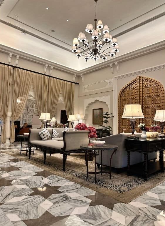 Elegant living room interior featuring classic furniture, chandeliers, and luxurious drapery for sop.